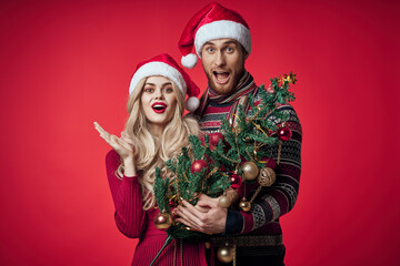 Fototapeta na wymiar Cheerful man and woman Christmas tree decoration toys romance