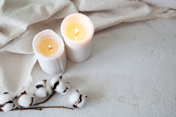 Spa relax background with candles and cotton, autumn mood, white cute picture, cosy autumn background