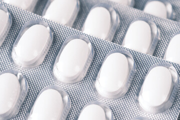 Close up of pills of blister pack ion table 