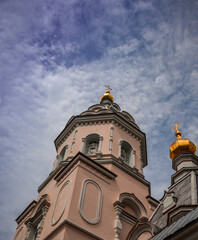 Fototapeta na wymiar Side view of the Koretsky Convent against the background of a cloudy sky. Ukraine.