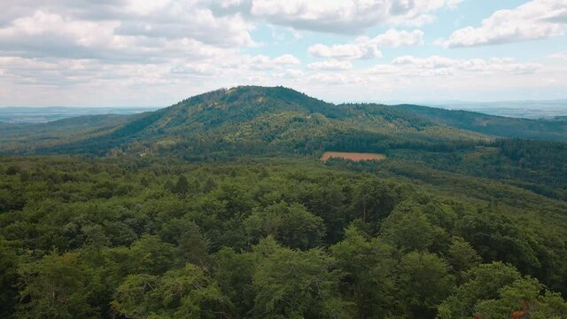 Drone flight over mountain village with forests. Sleza mountain near Wroclaw in Poland. Nature background, aerial view
