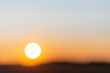 Blurred sunset landscape.Summer holiday concept. blurry beautiful sunlight and golden sunset background.