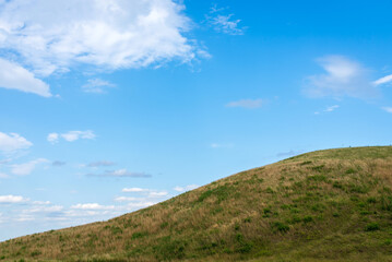 Summer mountain green grass and blue sky white clouds landscape