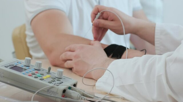 Patient nerves testing using electromyography at medical center