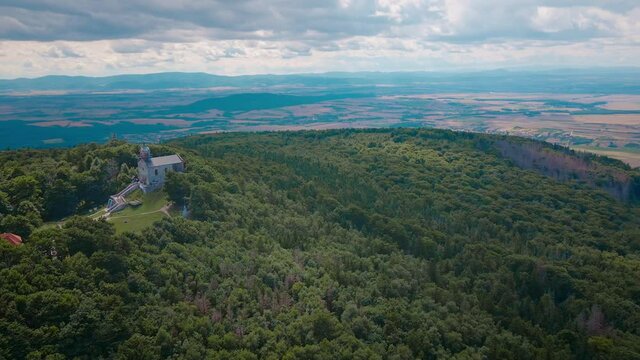 Drone flight over mountain village with forests. Sleza mountain near Wroclaw in Poland. Nature background, aerial view