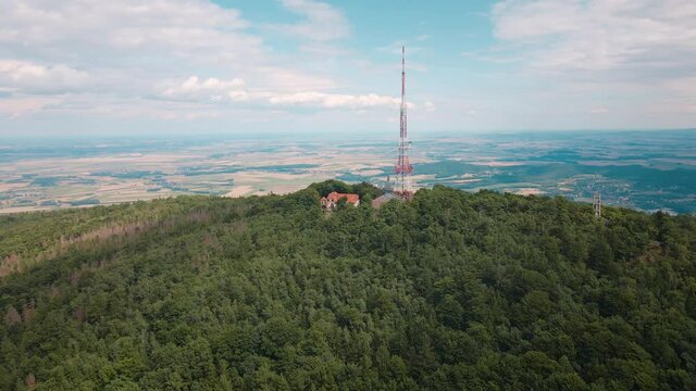 Drone flight over mountain village with forests. Sleza mountain near Wroclaw in Poland. Nature background, aerial view