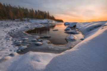 little bay  Lake Ladoga at dawn with fresh snow in winter