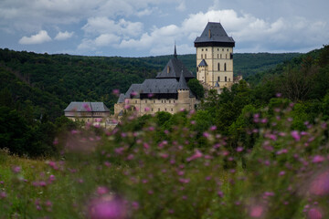 Fototapeta na wymiar Karlstejn Castle, historical building of the Czech Republic in the summer blooming scenery. Popular tourist destination/attraction near Prague.