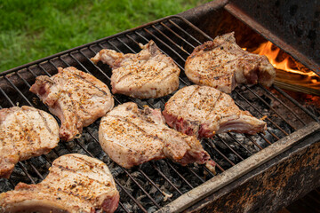 Roast pork entrecote on the grill.
