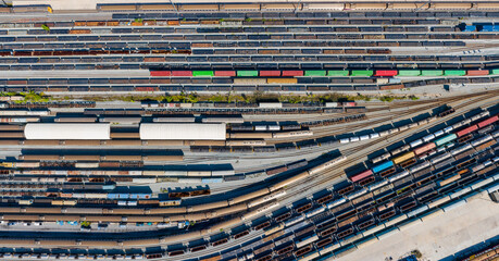 Aerial top view Passenger and freight trains on the railway station for transportation background....
