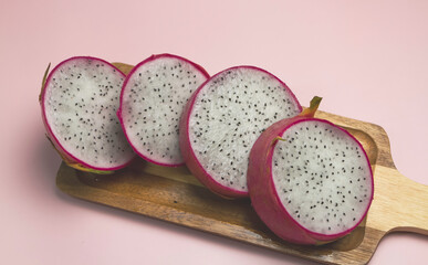 Sliced Dragon Fruit put on pastel background
