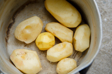 Ripe raw potatoes without skin. Peeled potatoes