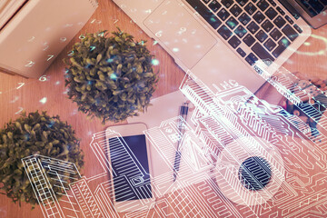 Multi exposure of smart city technology drawing over table with phone. Top view.