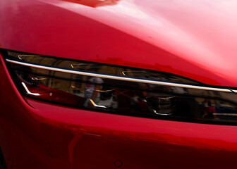 Headlight. LED headlamp of a modern car. Frontal lighting of highway vehicles with daytime running...