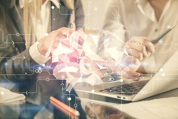 Double exposure of man and woman working together and brain drawing hologram. Intellectual brainstorming concept. Computer background.