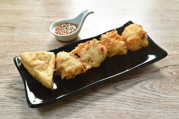 deep fried tofu and taro with corn dipping sweet crushed bean sauce on bowl