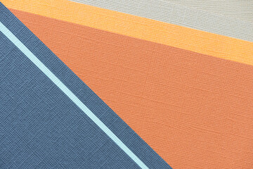 blue and orange with beige paper background