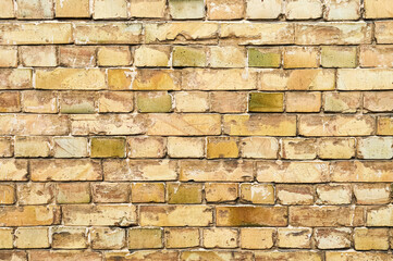 Obraz premium Old yellow brick wall, grunge background. Copy space