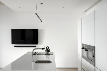 White modern kitchen with cupboard and counter