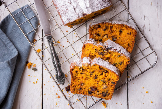 Sweet pumpkin bread with nuts and cranberries, traditional autumn dessert