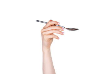 Hand holding aluminum spoon on white background isolated. Food and restaurant items. Concept of hands and body parts.
