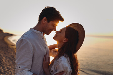 Close up profile happy young couple two friends family man woman in white clothes hug touch noses...