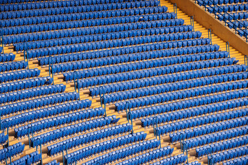 Obraz premium Blue empty seats at the stadium.