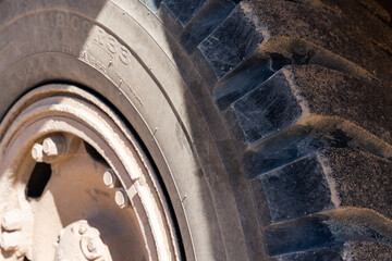 The deep, thick grooves line the tires of a tractor
