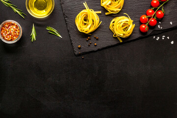 Pasta ingredients with tomatoes olive oil spices and herbs