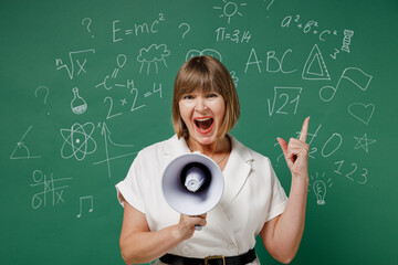 Teacher mature elderly woman 55 wears white shirt hold scream in megaphone announces discounts...