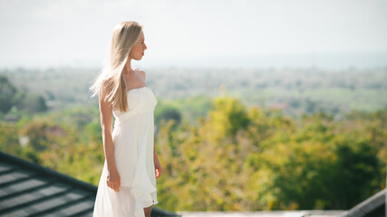 beautiful girl in white dress in hotel resort