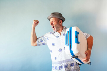 Euphoric men holding a suitcase on summer vacation.