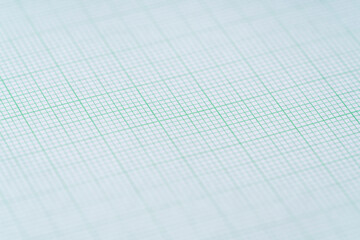 close up of green graph paper, research and education concept