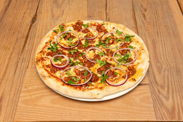 Great BBQ pizza with raw red onion rings and lots of parsley. Minced meat with tomato and baked...