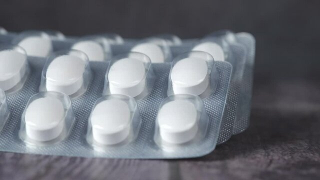Close up of pills of blister pack ion table 
