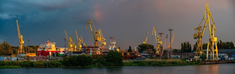 Fototapeta na wymiar Panoramic view of Szczecin shipyards during a passing evening storm