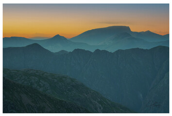Ben Nevis Mountain at Sunrise with multiple Layers of the mountains of Glencoe.