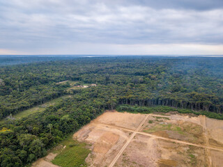 Fototapeta na wymiar Aerial view of deforestation of Amazon rainforest. Forest trees destroyed to open land for commercial area. Concept of environment, ecology, climate change, global warming, carbon emissions. Amazonas.