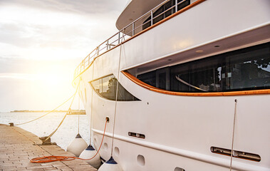 Large catamaran at the marina. Pleasure or passenger catamaran on the pier.