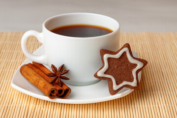 Star shaped chocolate chip cookies with anise and cinnamon with a cup of tea