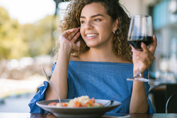 Woman having lunch at a restaurant.