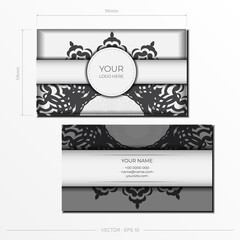 Vector Preparation of business cards in white with black patterns. Template for print design business card with monogram ornament.