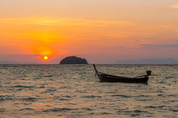 Long tail boat waiting for passengers in the morning, southern Thailand