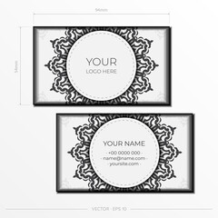 Preparing business cards in white with black ornaments. Vector Template for print design business card with monogram patterns.