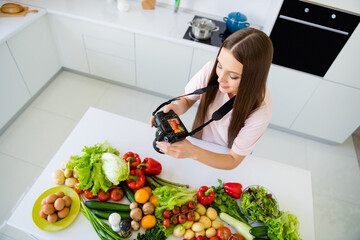 Top above high angle view portrait of attractive long-haired girl cooking food making photo post at home light white kitchen indoors