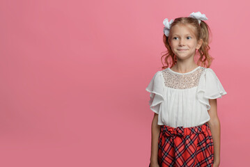 portrait of a cute schoolgirl with different emotions Isolated on pink background