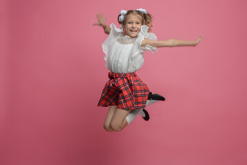 portrait of a cute schoolgirl with different emotions Isolated on pink background