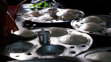 Fresh steamed Indian Idly (Idli / rice cake),  traditional breakfast of South India.