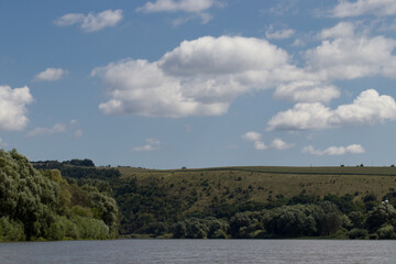 white blue nobo clouds over the river