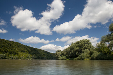 white blue nobo clouds over the river